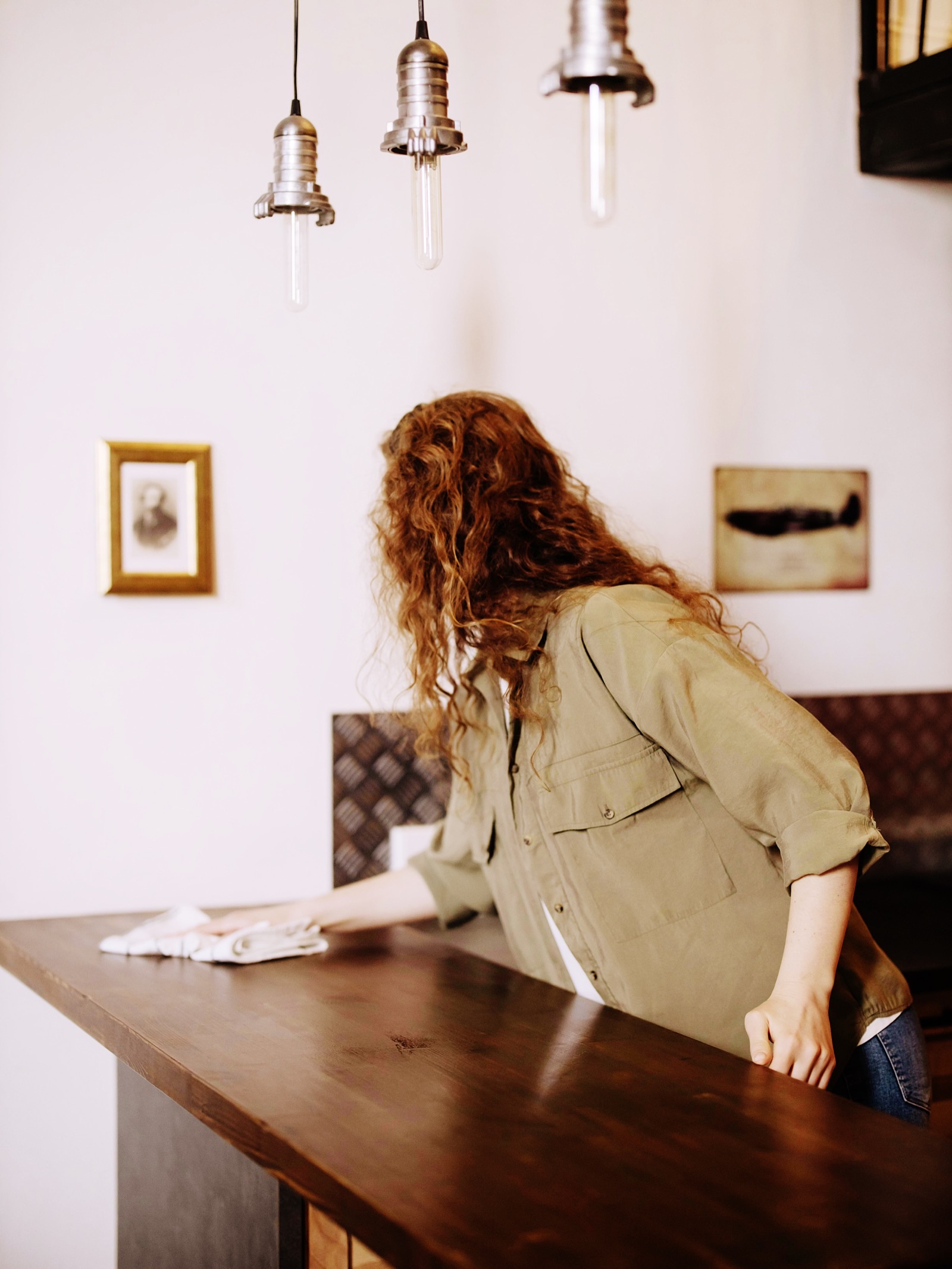 Professional cleaner wiping kitchen counter